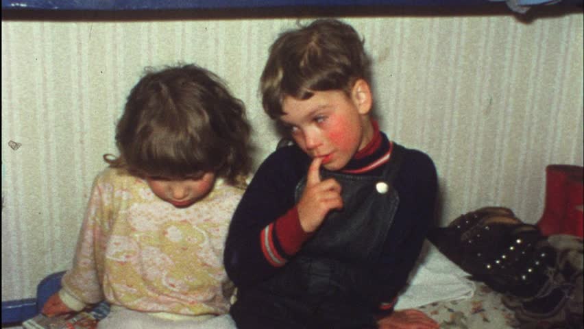 Sad boy wants sister to comfort him (Vintage 8 mm amateur film)