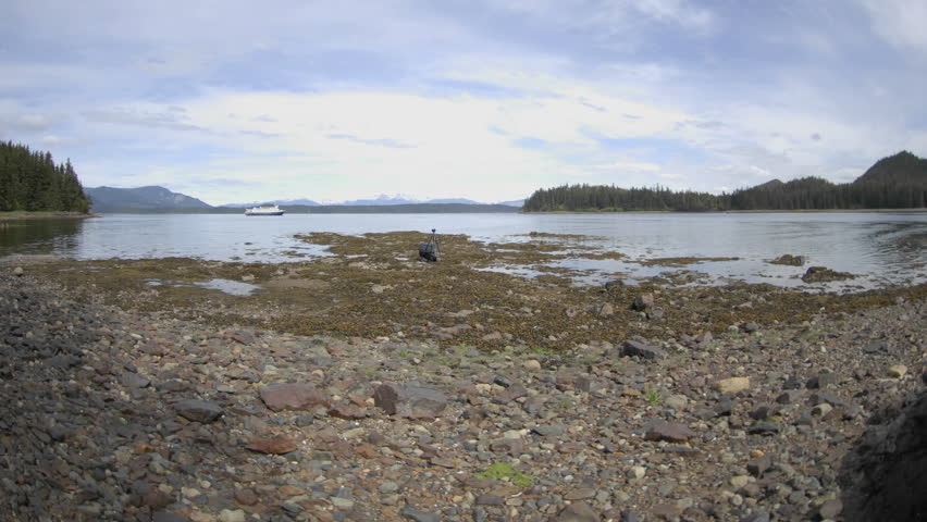 CHICHAGOF ISLAND, AK - CIRCA 2009: Time lapse of the tide rising in Pavlof Harbor circa 2009 in Chichagof Island in Southeast, Alaska.