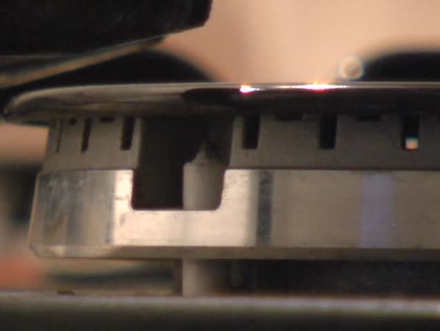turning-on a gas cooker