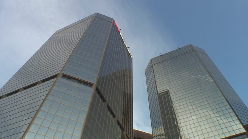 Multiple short tracking shots of modern office buildings; low angle, street to sky, Denver Colorado