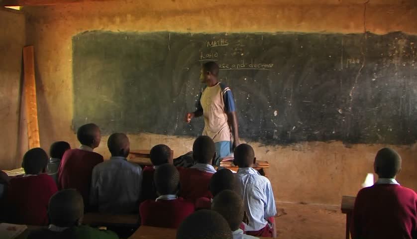 KENYA, AFRICA - CIRCA 2009: One of the boys from the class gives instruction to his classmates circa 2009 in Kenya.