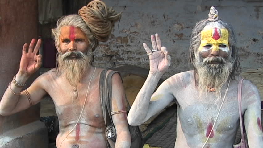 KATHMANDU, NEPAL - CIRCA 2005: Hindu Sadhus posing with religious hand gesture at Pashupati Temple circa 2005 in Kathmandu.
