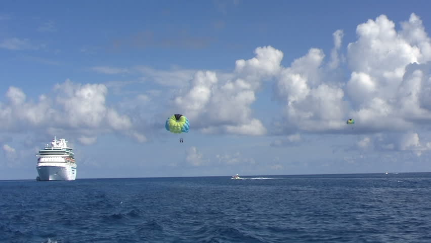 BAHAMAS - CIRCA APRIL 2009: Tourists parasailing.