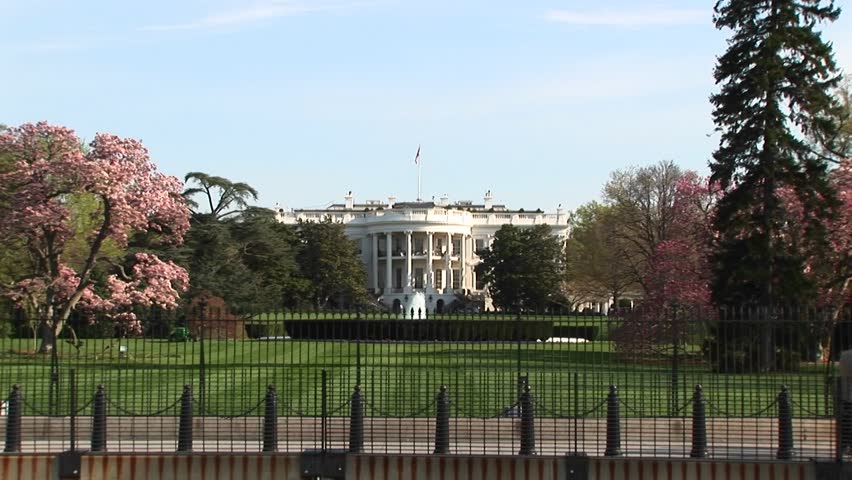 The camera zooms in for a look at the White House in springtime.