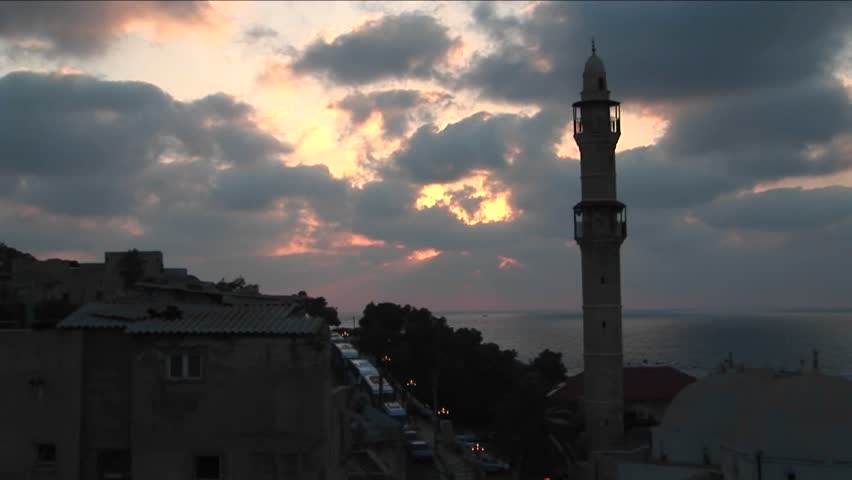 Clouds drift above the minaret of a mosque in Israel