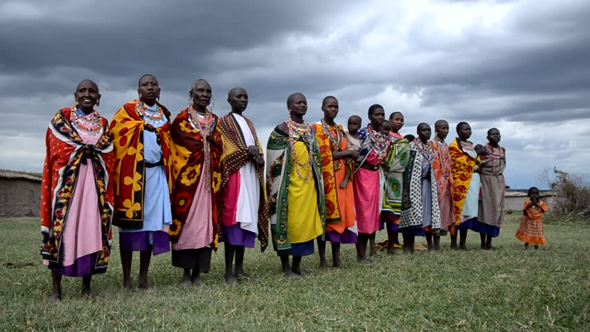 MASAI MARA, KENYA, AFRICA - OCTOBER 17: Masai women  singing as part of a traditional cultural ceremony near Masai Mara National Park Reserve, Kenya on October 17, 2011