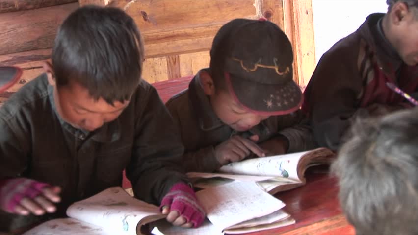 BEIJING, CHINA - CIRCA 2009: Children study hard at a rural school circa 2009 in Beijing.
