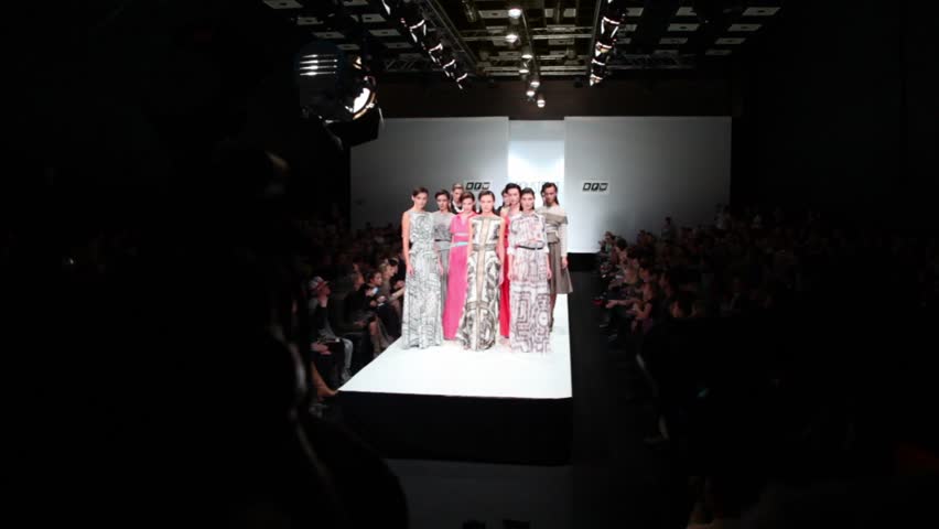 MOSCOW - NOVEMBER 19: Many models in dresses from Liliya Pustovit collection, walk away on podium at Russian Fashion Week, on November 25, 2010 in Moscow, Russia.