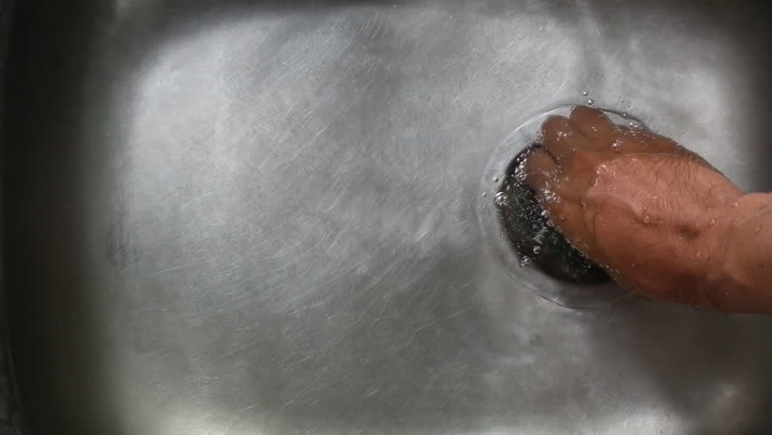Water flows into the drain hole
