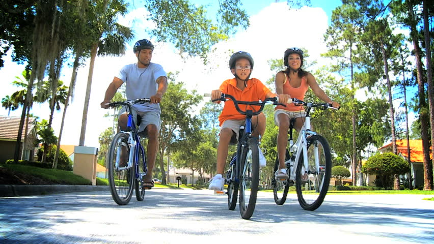 Healthy Ethnic Family Bike Riding Together