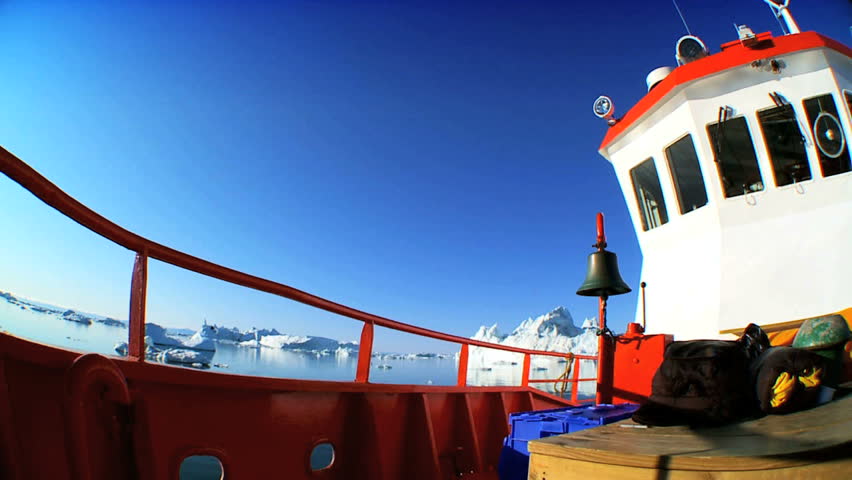 Nautical Vessel Sailing Past Icebergs
