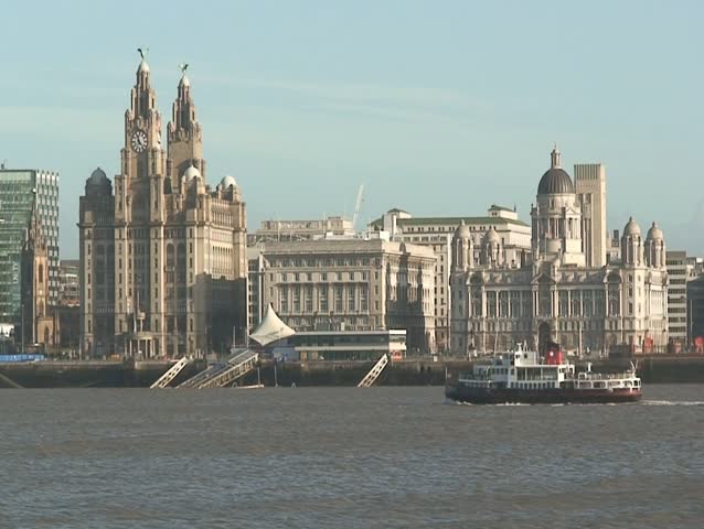 Mersey Ferry sailing past the Liver Buildings, Liverpool, UK