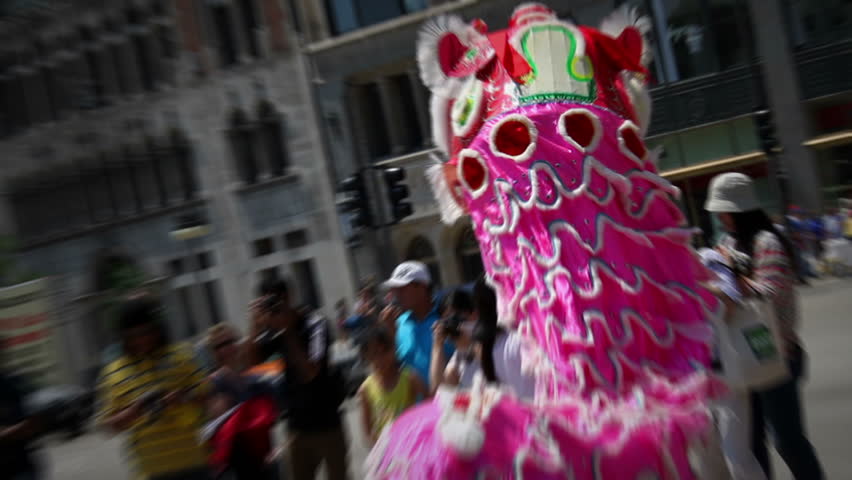 A Chinese cultural display in downtown Chicago where people danced under traditional Chinese dragon costumes with music.