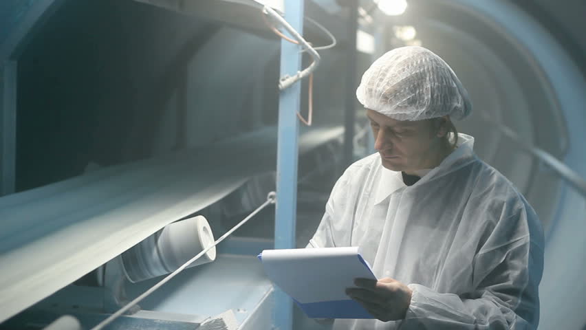 Quality inspector monitoring the process of crystal sugar production, HD 1080i.