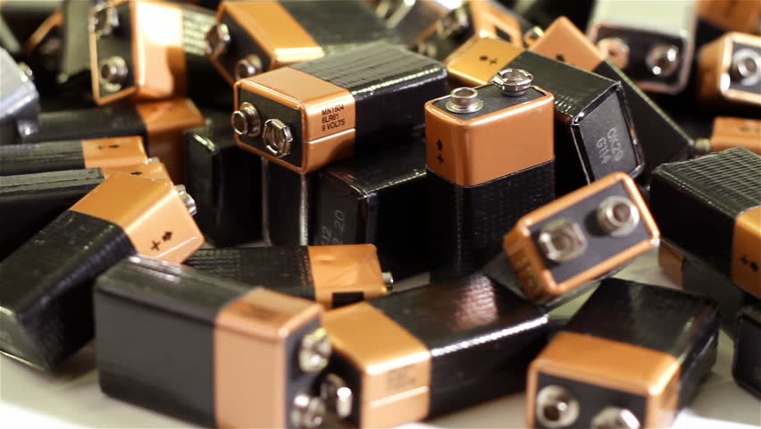 A pile 9-volt batteries spinning on a turntable.