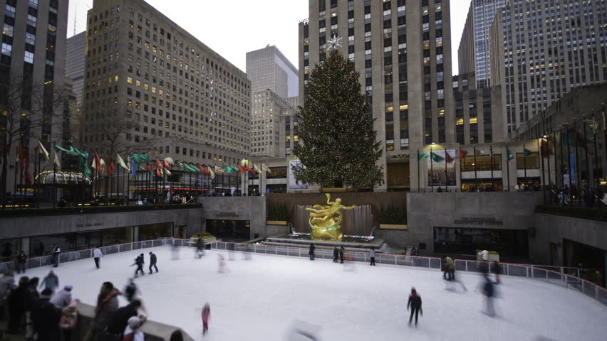 NEW YORK - CIRCA JANUARY 2011: Day to Night time lapse of Rockefeller Plaza skating rink circa January 2011 in New York city.