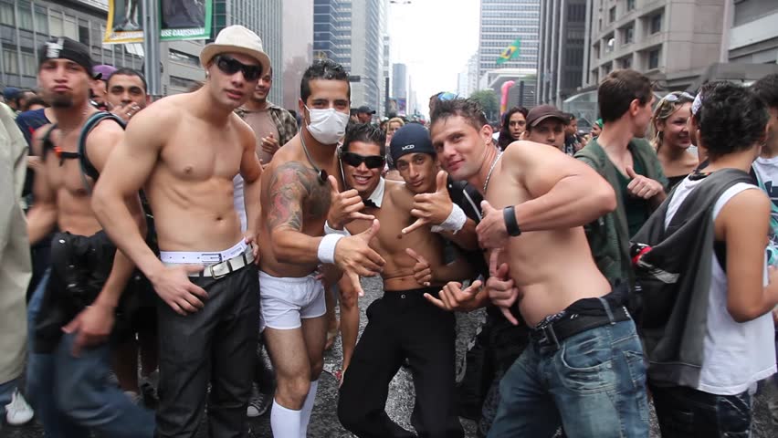 SAN PAULO, BRAZIL - CIRCA JUNE 2011: Shirtless men pose at the LGBT Gay Pride Parade on Avenida Paulista circa June 2011 in San Paulo.