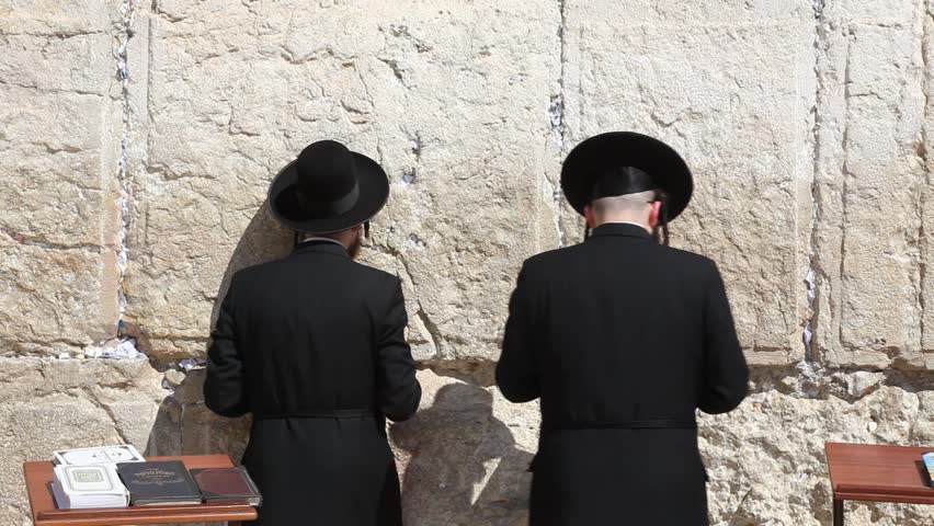JERUSALEM, ISRAEL - CIRCA OCT 2011: Orthodox Jews pray at the Western Wall circa October 2011 in Jerusalem.