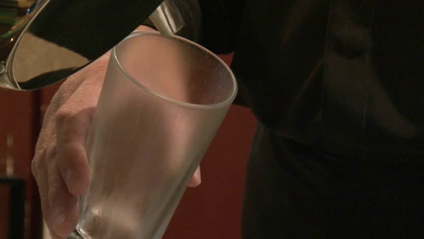 A beer being poured from the beer tap in bar