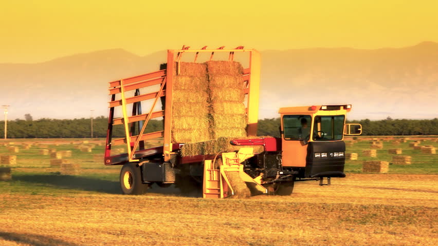 Hay Bale Machine Loader on Farm