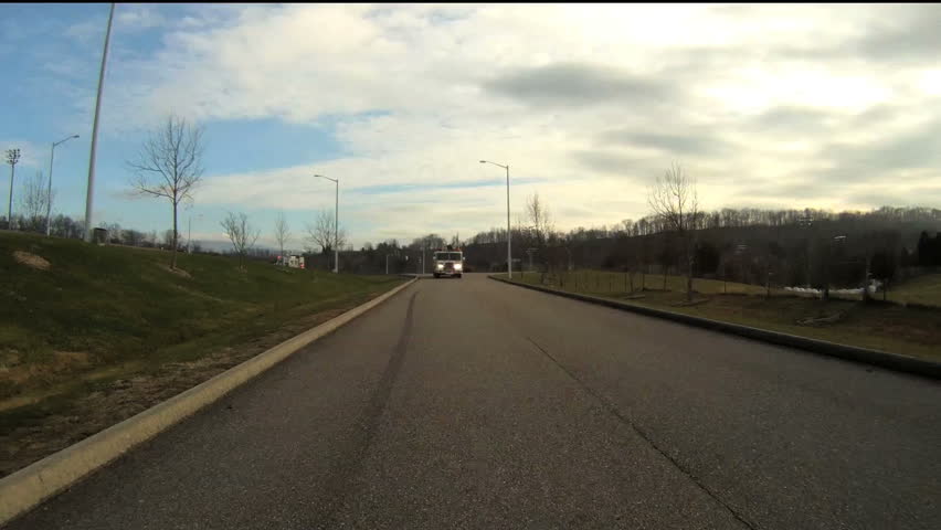Fire Truck comes up behind vehicle with lights and siren.  