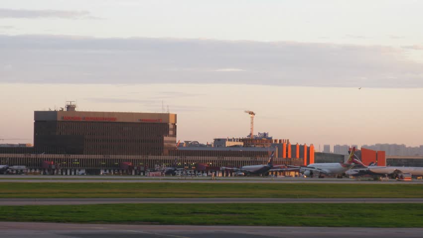 MOSCOW - SEPTEMBER 22: (Timelapse View) Planes stand near terminal F of airport of Sheremetyevo in evening, on September 22, 2011 in Moscow, Russia 