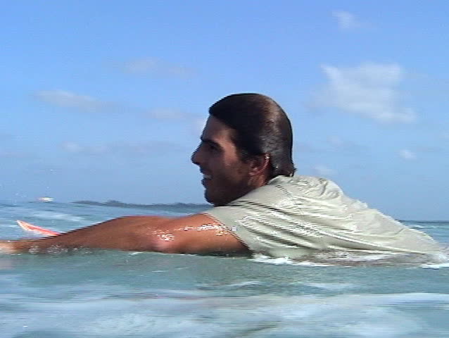 Surfer swimming