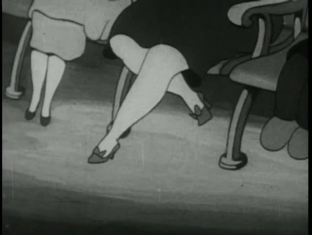 Woman slapping innocent man when cat and dog rub up against her leg in movie theater