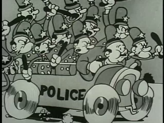 Wide shot policemen in car waving billy clubs