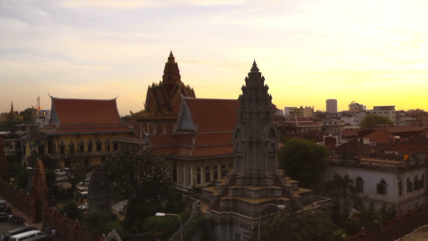 City view of Phnom Penh, Cambodia, with buildings, street, traffic and Tonle Sap river