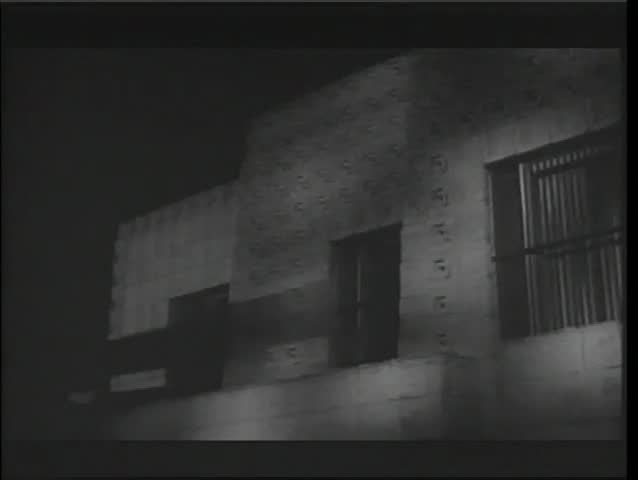 Close-up adobe house during thunderstorm