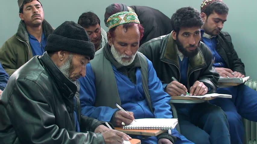 KABUL - CIRCA 2011: Students learn about about traffic in the school circa 2011 in Kabul. Since 2002, the education sector has been going through a nationwide rebuilding process as new institutions are established and more students enrolled.
