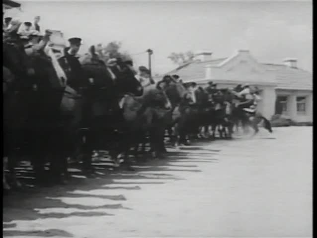 Historical reenactment World War II - armed peasants on horseback