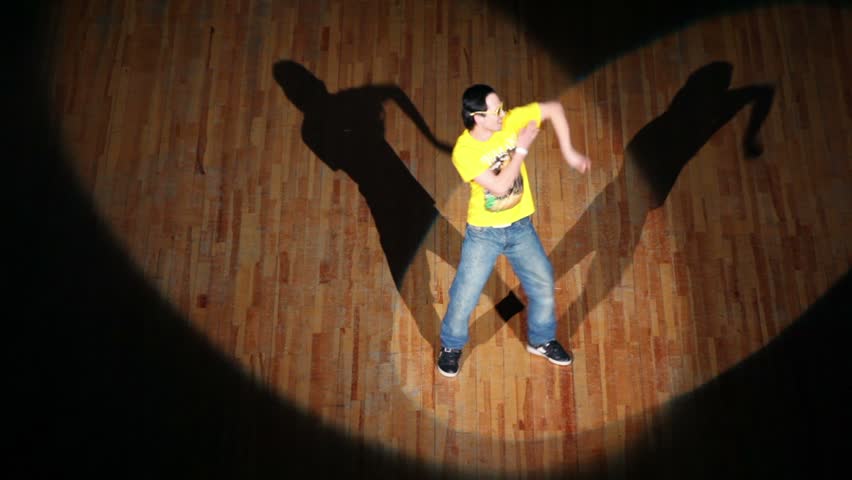 MOSCOW - MARCH 27: Guy in jeans, yellow shirt and sunglasses dance lit on contest at HHI - Cup of Russia, Championship IV on March 27, 2011 in Moscow, Russia.