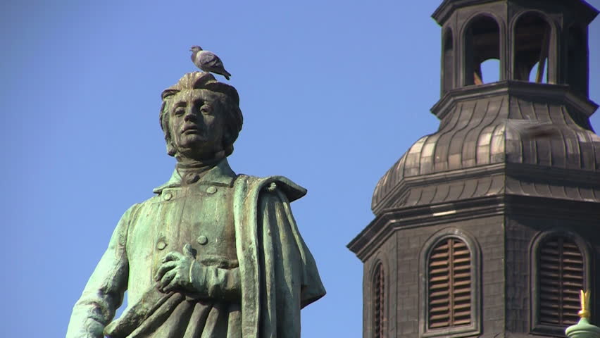 Monument of Great Polish Poet Adam Mickiewicz and Town Hall Tower, Krakow, Poland