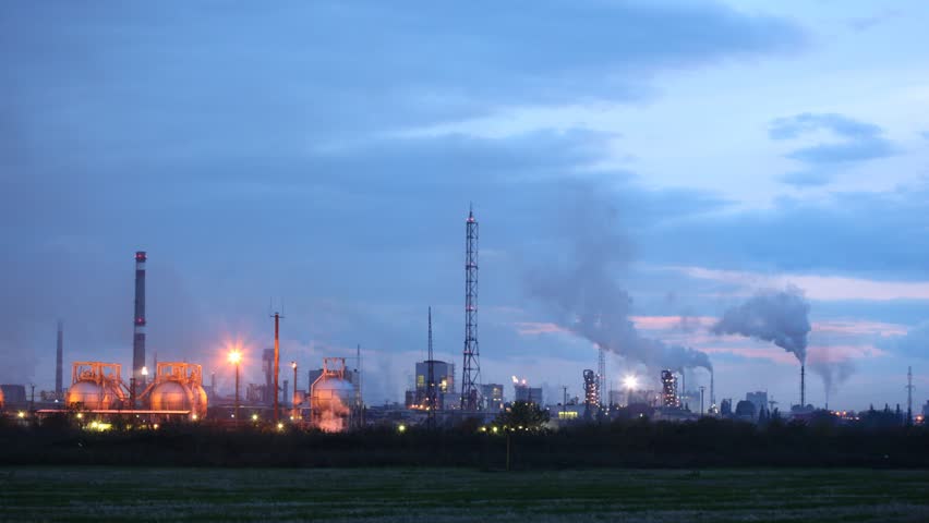 Chimney shaft of phosphoric factory stand against sky in night, time lapse 