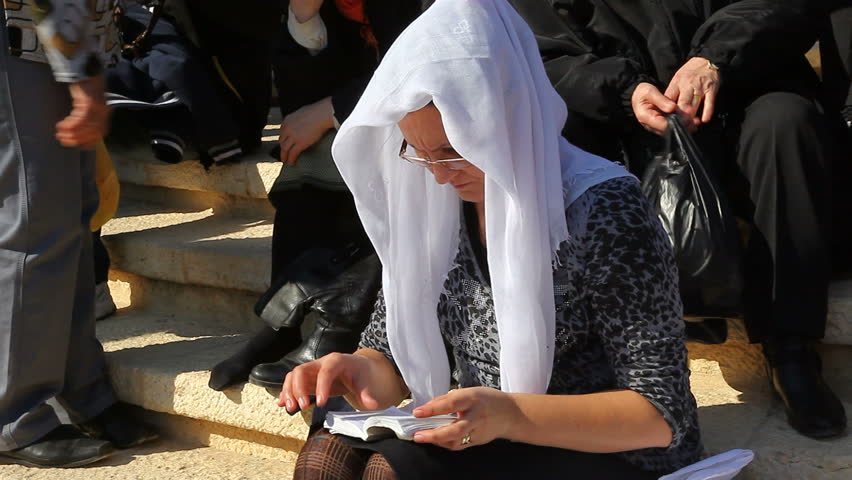 QASR AL YAHUD, ISRAEL - JANUARY 18: Pilgrim relaxes during the Epiphany at Qasr Al Yahud, Israel on January 18, 2012.