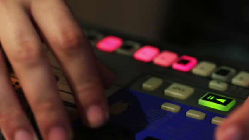 DJ creating music on an analog synthesizer