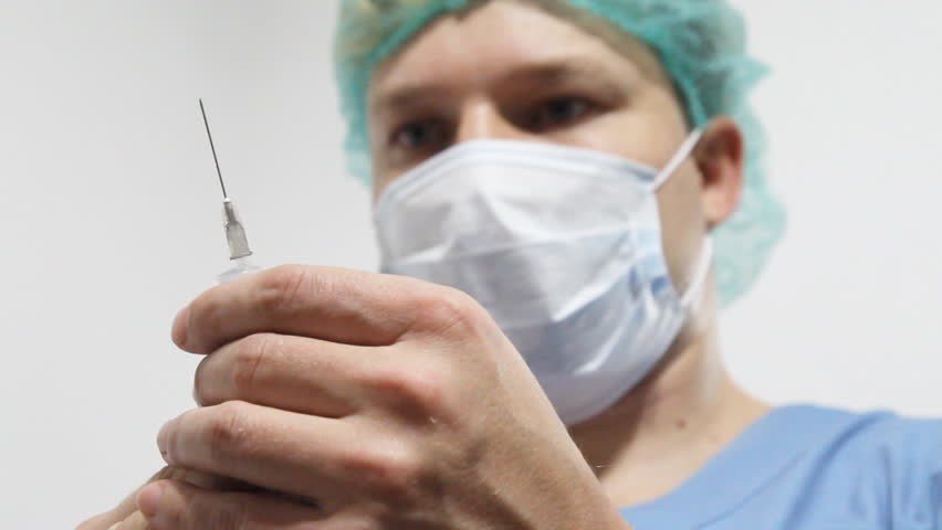 Doctor with syringe