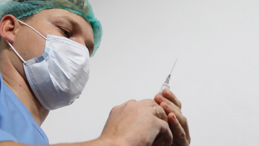 Doctor with syringe