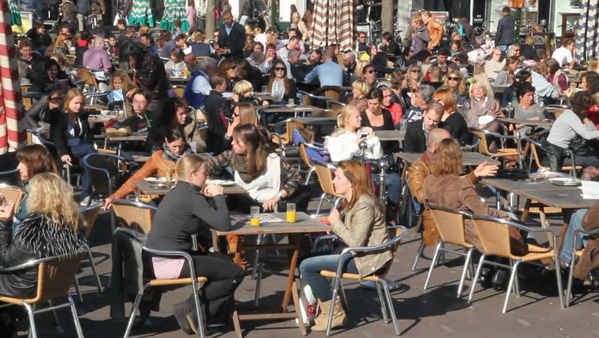 THE HAGUE, HOLLAND - OCTOBER 15 - People sit on a cafe terrace in a The Hague town square on October 15, 2011. 