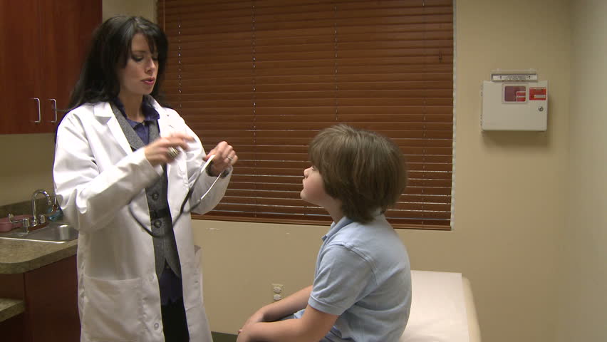 Female doctor begins pediatric checkup