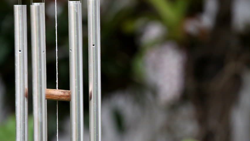 wind chime hanging with orchid background