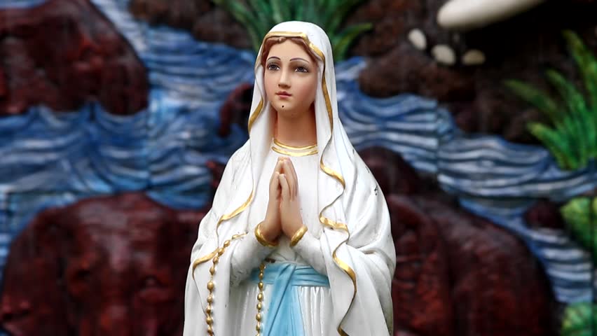 A praying virgin Mary statue with  fountain
