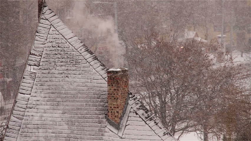 Blizzard and smoking chimney