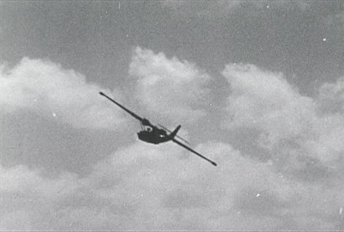 ATLANTIC OCEAN - CIRCA 1942-1944: World War II, U.S. Naval Sea Plane Flying Past Camera, publisher National Broadcasting Service (U.S.)
