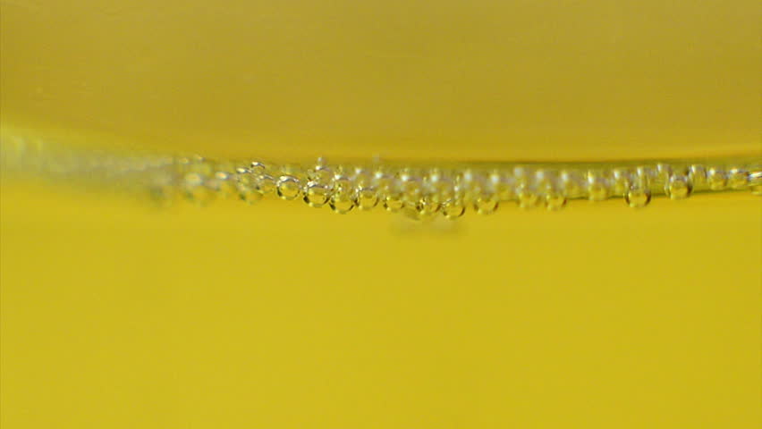 bubbles inside a glass of champagne (seamless loop)