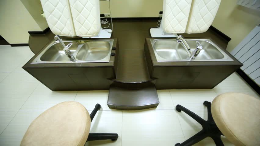 In cosmetology room for pedicure in beauty salon there are two special seats