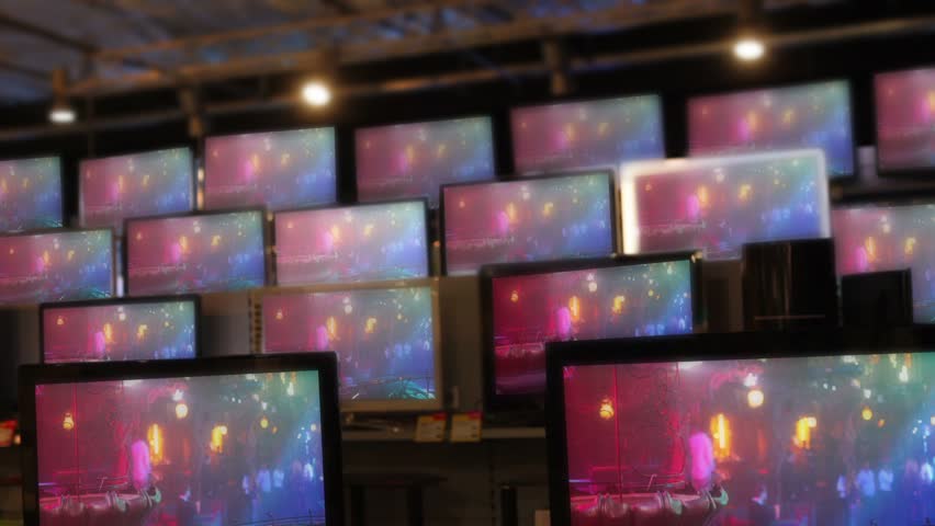 Many flat tv sets stay working on showcase in shop, Pavel Losevsky footage inserted on screen