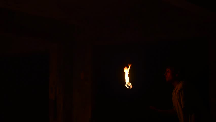 man with burning lamps